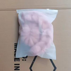Soft pink mesh bath sponge in independent frosted bag, large body scrubber for daily shower.