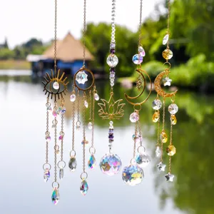 Detail view of crystal suncatcher hanging with metal moon sun lotus pendants for outdoor decor.