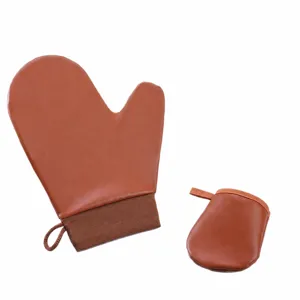 Brown self tanning mitt set, large lotion applicator glove and mini velvet finger mitt.