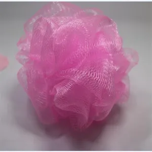 Pink mesh bath sponge for daily body washing and exfoliating shower puff body scrubber.