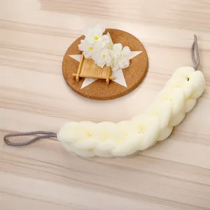 Detailed view of the stretchable mesh back scrubber bath sponge with dual hanging ropes.