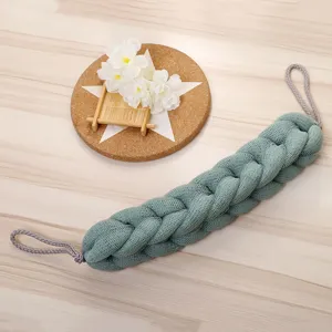 Detailed view of the braided mesh bath back scrubber in grey-green, designed for easy self-bathing.
