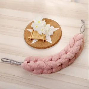 Large pink mesh bath back scrubber strap with hanging loops, ideal for daily body cleaning.