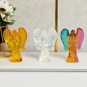 Crystal angel ornament detail showing transparent and colorful reflective glass craftsmanship.