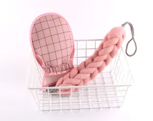 Pink mesh bath sponge scrubber and grid exfoliating mitt detail view for daily body cleansing.