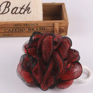 Black and red color-blocked mesh bath sponge with hanging cord for daily shower cleaning detail.