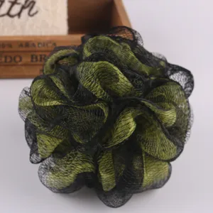 Close-up detail of a black and green mesh bath sponge, showcasing fine texture and soft surface.
