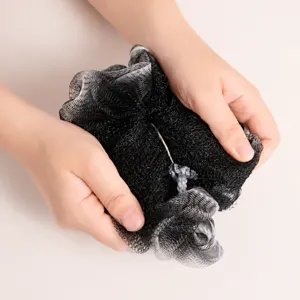 Black and white gradient shower sponge loofah for body cleaning and rich bubble bathing.