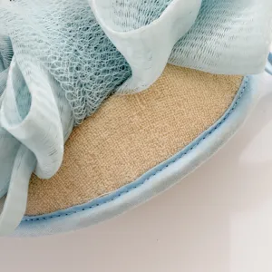 Dual-use mesh bath sponge and body scrubber in light blue, perfect for daily gentle shower care.