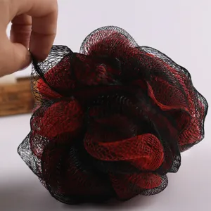 Black and red shower sponge for rich lather, soft exfoliating mesh bath puff daily use.
