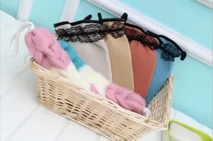 Nordic style bath sponge and mesh scrubber set with lace trim, durable and stretchable design.