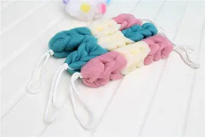 Long mesh bath sponge scrubber with loops for easy body washing and back scrubbing.