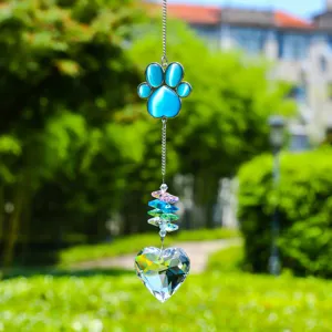 Crystal suncatcher detail showing blue paw pendant, colorful crystal beads, and heart prism.