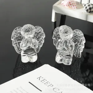 Crystal clear praying angel figurine detail, transparent glass sculpture for desktop decor.