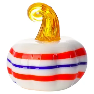 Handmade glass pumpkin figurine with colorful stripes, perfect autumn and holiday home decor.