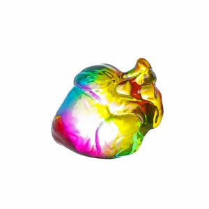 Detailed view of the colorful crystal anatomical heart sculpture, stunning rainbow glass ornament.