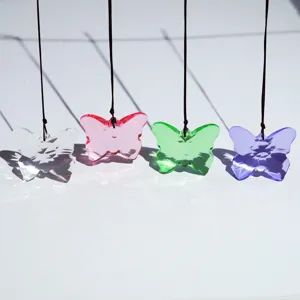 Crystal butterfly pendant detail showing vibrant colors and transparent material design.