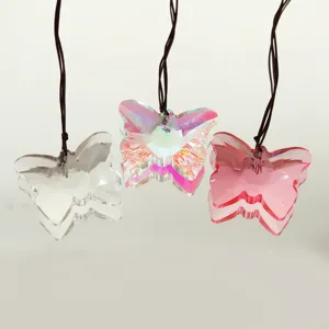 Crystal butterfly pendant detail showing multi-colored crystal facets and hanging cord.
