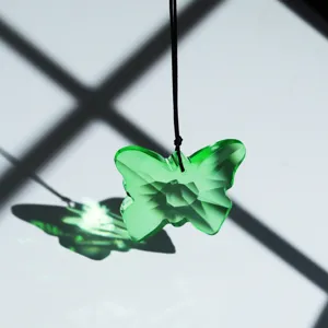Detailed view of the sparkling green crystal butterfly pendant suncatcher ornament.