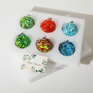 Colorful hand-blown glass sun catcher balls set for Christmas tree and outdoor garden decor.