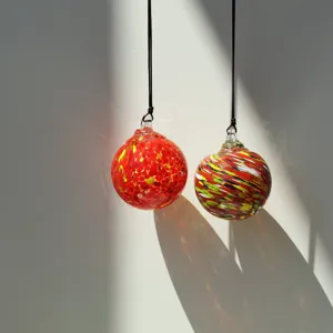 Handmade blown glass sun catcher hanging balls decorative colorful spheres with black cord pair.