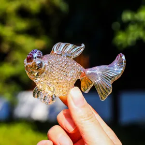 Detail shot of a colorful crystal goldfish glass figurine, exquisite craftsmanship table ornament.