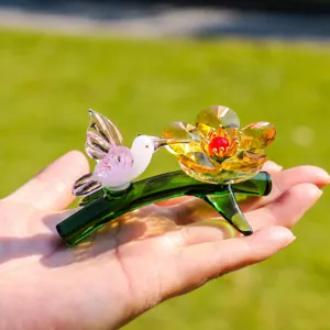 Crystal hummingbird and flower ornament detail, vibrant glass art figurine for desktop decor.