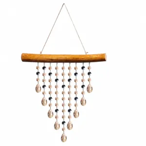 Crystal wind chime hanging pendant detail showing multi-layered faceted crystal beads on wood.