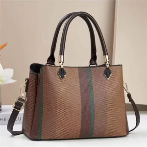 Élégant sac à main pour femme avec design colorblock tendance et poignées confortables.