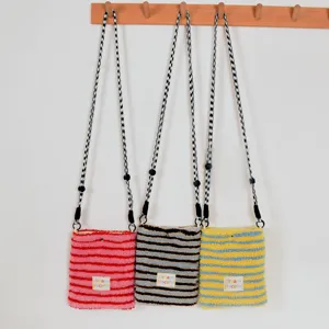 Plush striped crossbody phone bag, cozy autumn winter small shoulder bag detail display.