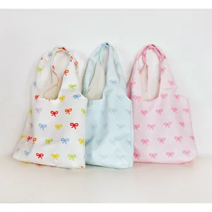 Canvas bow tote bag, lightweight casual shoulder bag for women, cute daily commuter travel.