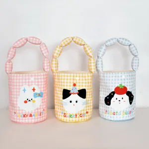 Detailed shot of cute checkered canvas tote bags with cartoon animal prints, multi-color.