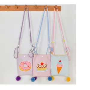Bonito bolso cruzado de lona para niños y niñas, con bordado adorable y pompones coloridos.