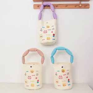 Canvas bucket bag with cute embroidered patterns and padded handles, stylish handbag daily use.