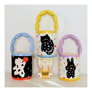 Cute polka dot cat animal print kids handbag detail, fluffy handle design, adorable tote bag.