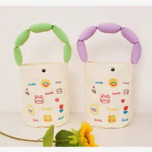 Canvas bucket bag with cute cartoon embroidery and colorful puffy handles for daily use