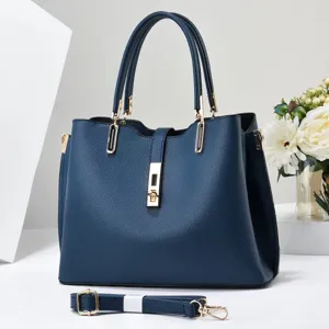 Detail view of a navy blue women handbag, minimalist large capacity tote bag with handles.