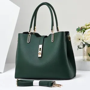 Elegant dark green leather handbag with gold hardware and detachable shoulder strap.