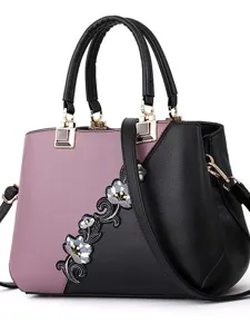 Elegante bolso de mano bicolor para mujer con correa y bonito bordado floral elegante.
