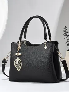 Schwarze Damentasche aus Leder, Henkeltasche mit Blattanhänger und großem Fassungsvermögen.