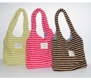 Plush striped tote bag detail, lamb fleece single shoulder handbag, cozy winter fluffy purse.
