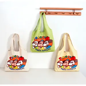 Canvas tote bag detail showing cute cartoon puppy print and large capacity design for daily use.