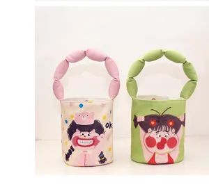 Canvas bucket handbag with cute cartoon print and unique bubble handle design for daily use.