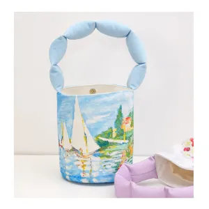 Canvas bucket bag with artistic oil painting sail print and cute blue cloud bubble padded handle.