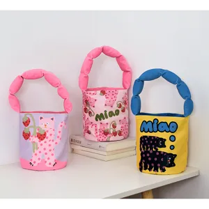 Cute cartoon canvas bucket bag with padded handle, stylish casual handbag for women and kids.
