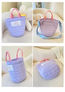 Purple quilted bucket bag with pink handles and crossbody strap, stylish casual tote handbag.