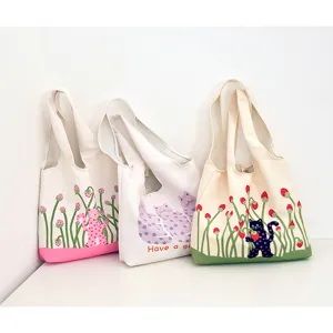 Cute polka dot cat print canvas shoulder bag, casual large capacity tote for daily use.