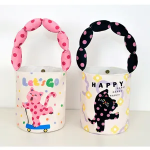 Cute canvas bucket bag with bubble padded handles and cartoon cat print for daily use casual style.