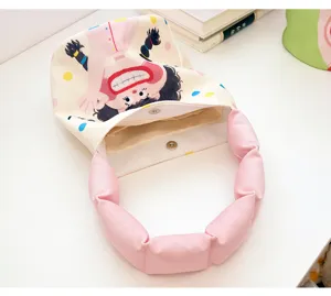 Canvas bucket bag with pink cloud handle and cute cartoon print, stylish daily handbag.