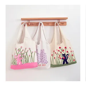 Cute polka dot cat print canvas tote bag, large capacity shoulder bag for daily casual use.